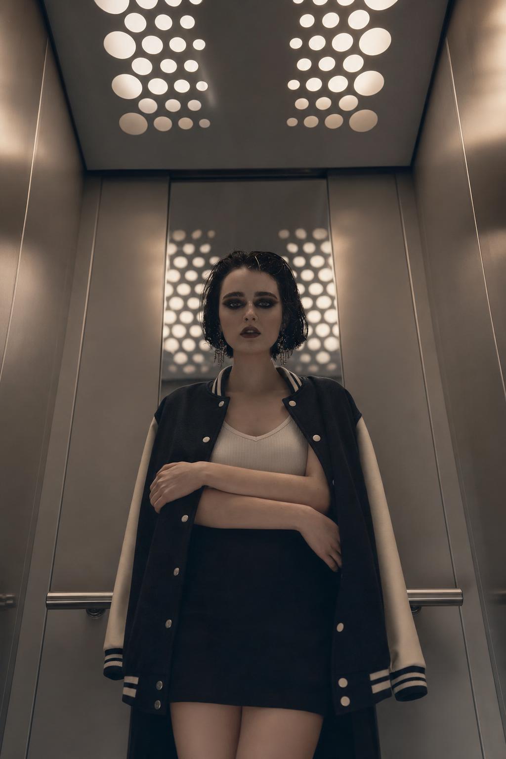 ChatGPT AI Selfie Prompt for a Realistic Elevator Varsity Jacket Portrait generated result